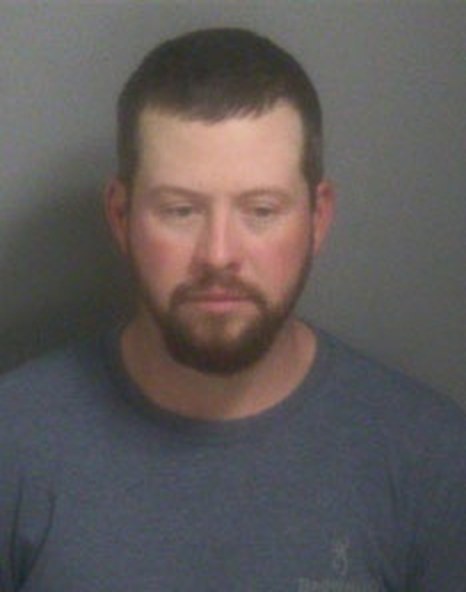 Booking photo — Travis Lee Busch